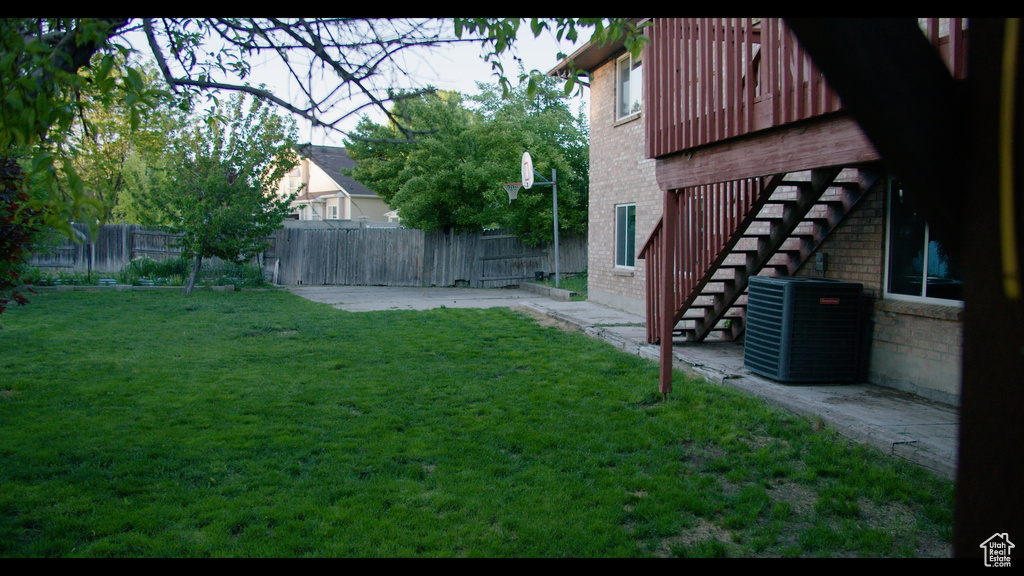 View of yard featuring a patio and central AC