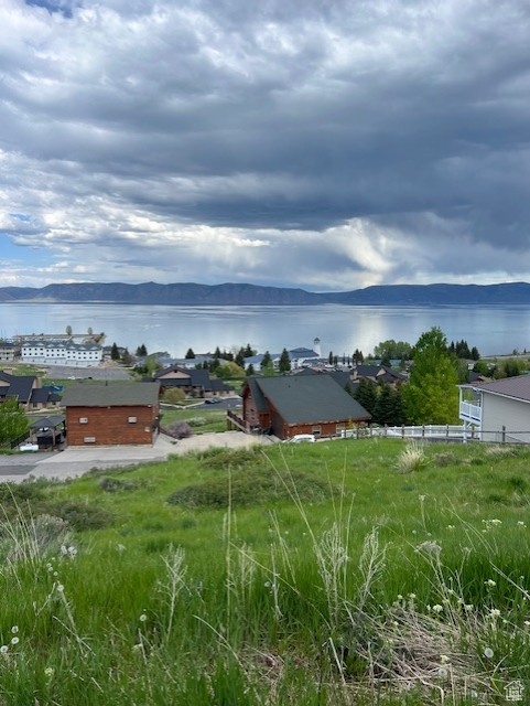 View of yard with a water view