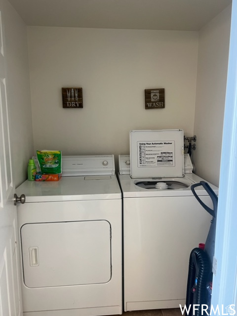 Washroom featuring washing machine and clothes dryer