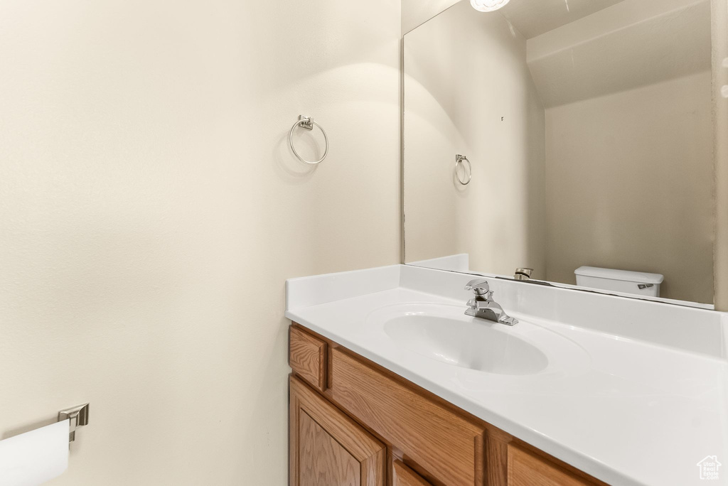 Bathroom with vanity and toilet