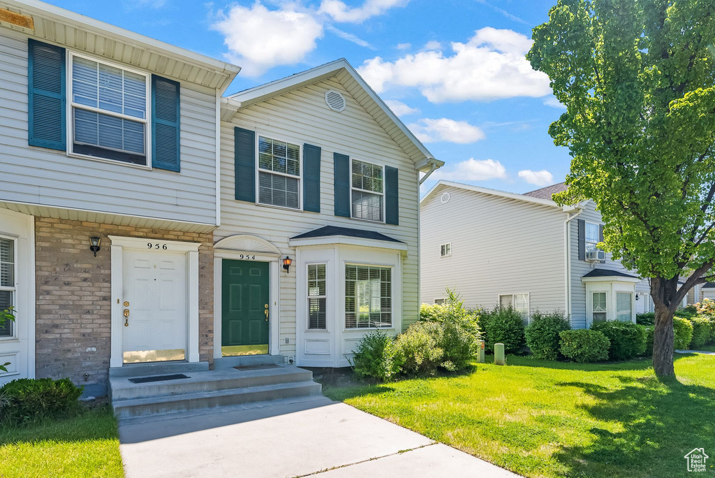 View of front of property with a front lawn