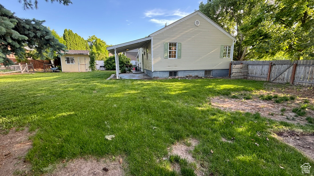 Exterior space with a lawn and a patio area