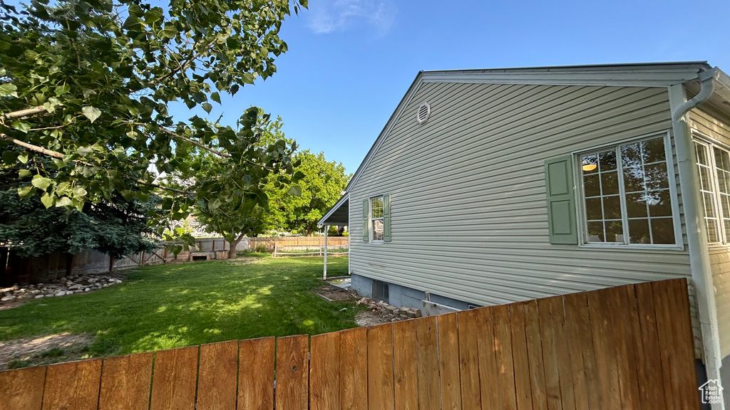 View of home\'s exterior featuring a lawn