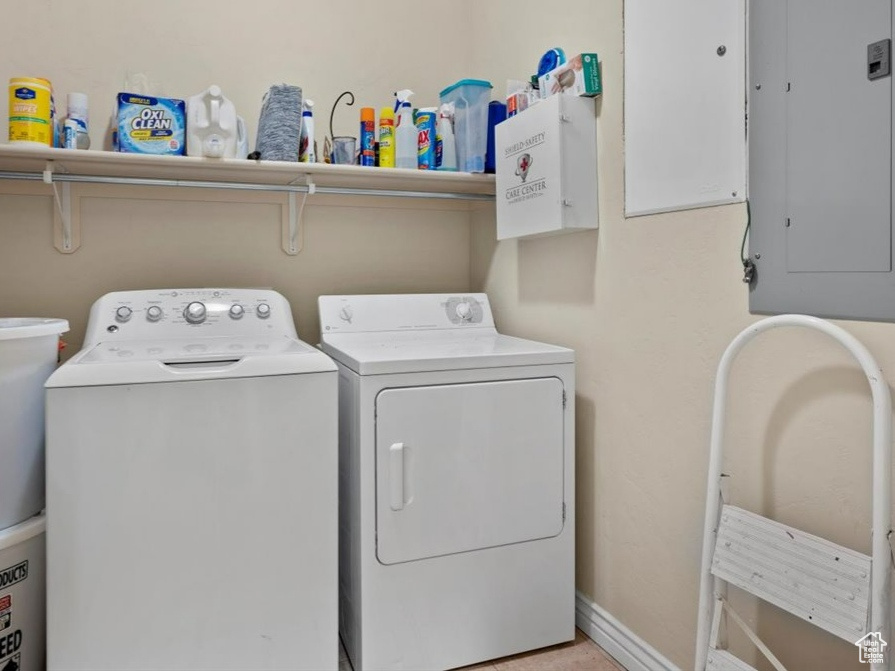 Washroom featuring washing machine and clothes dryer