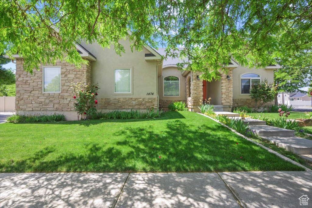 View of front of property with a front yard