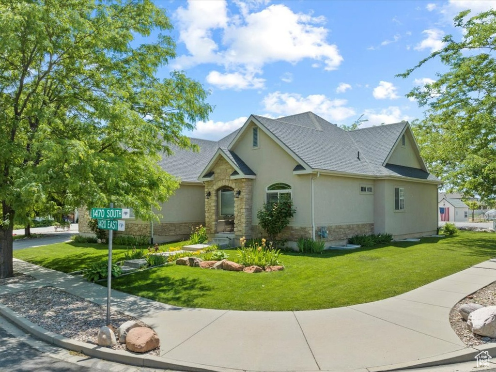 View of front of property with a front yard