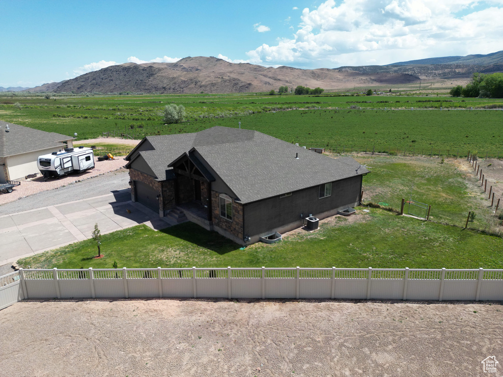 Aerial view featuring a rural view and a mountain view