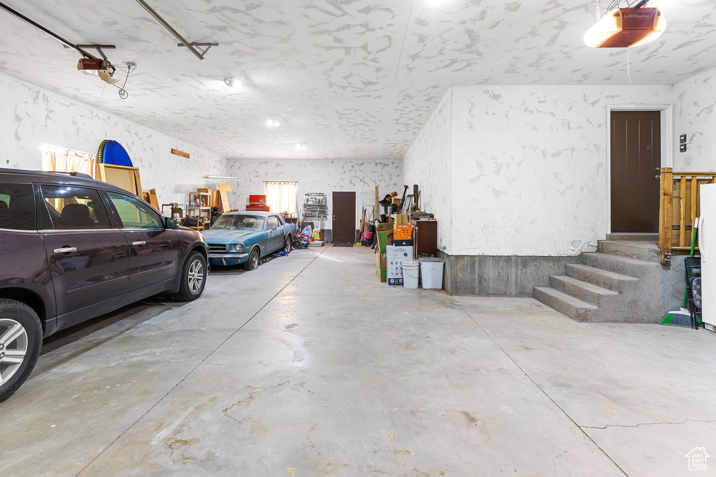 Garage featuring a garage door opener