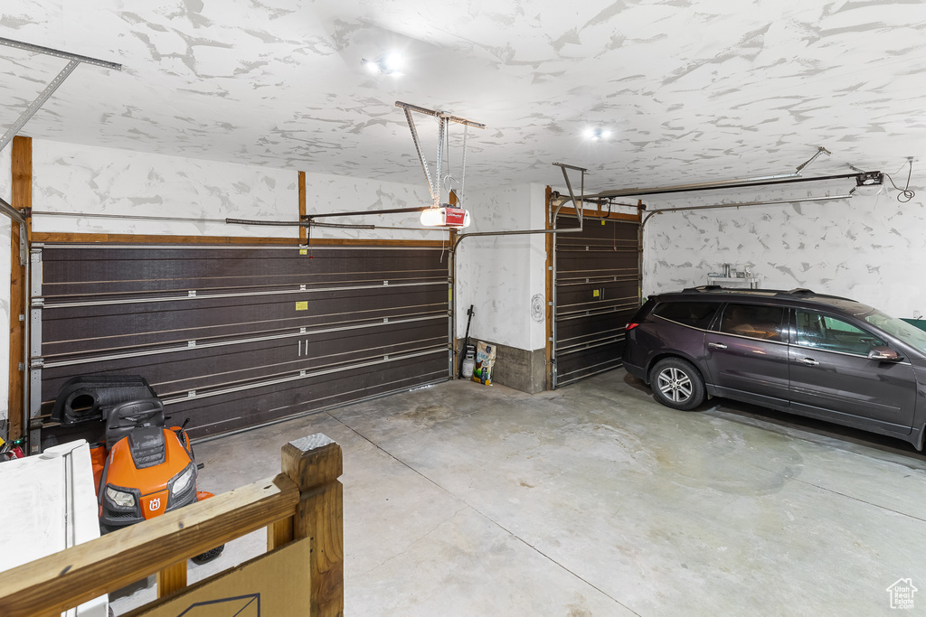 Garage featuring a garage door opener