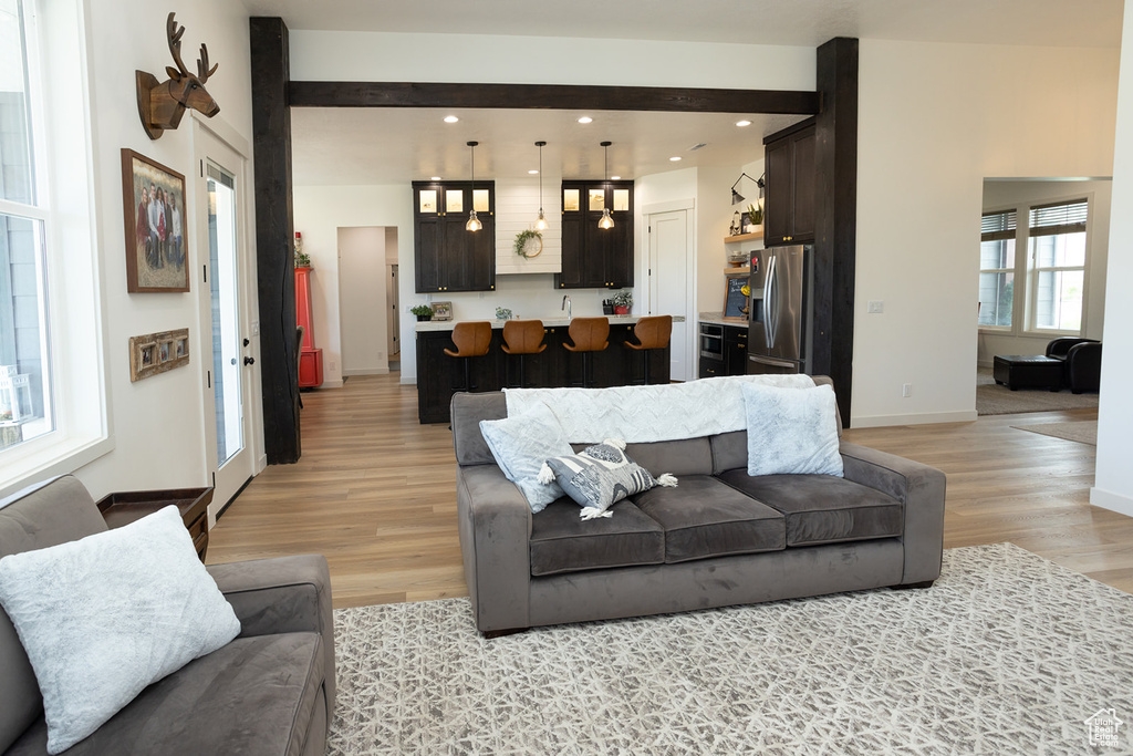 Living room with light wood-type flooring