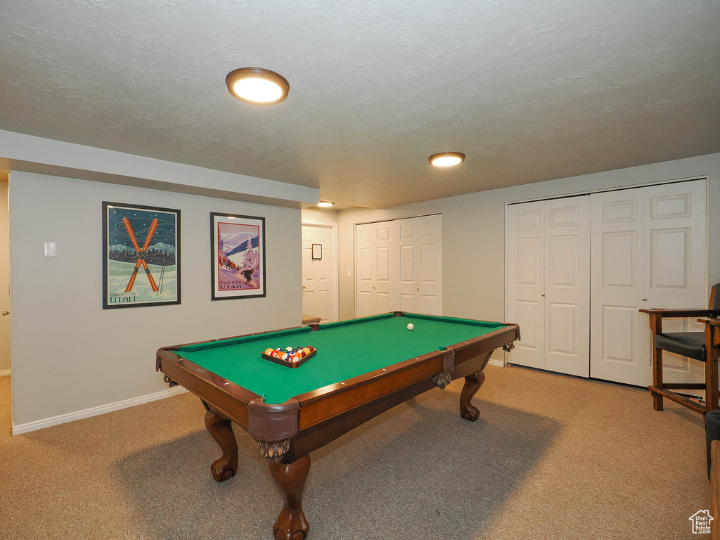 Rec room with pool table, a textured ceiling, and carpet floors