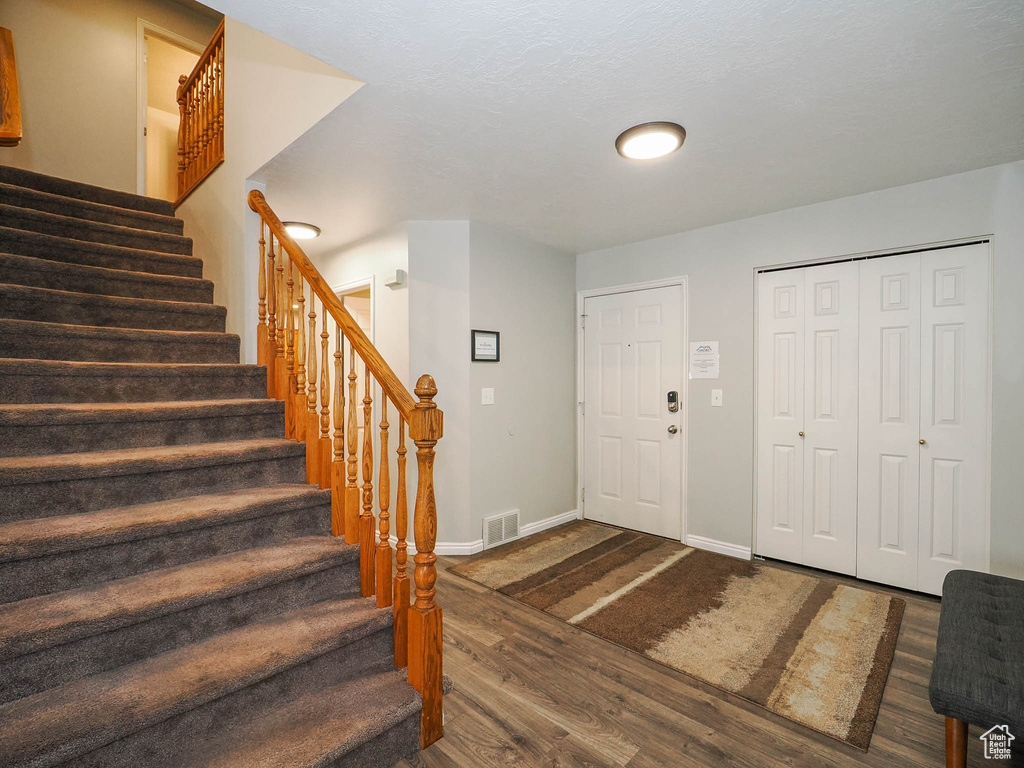 Foyer with wood-type flooring