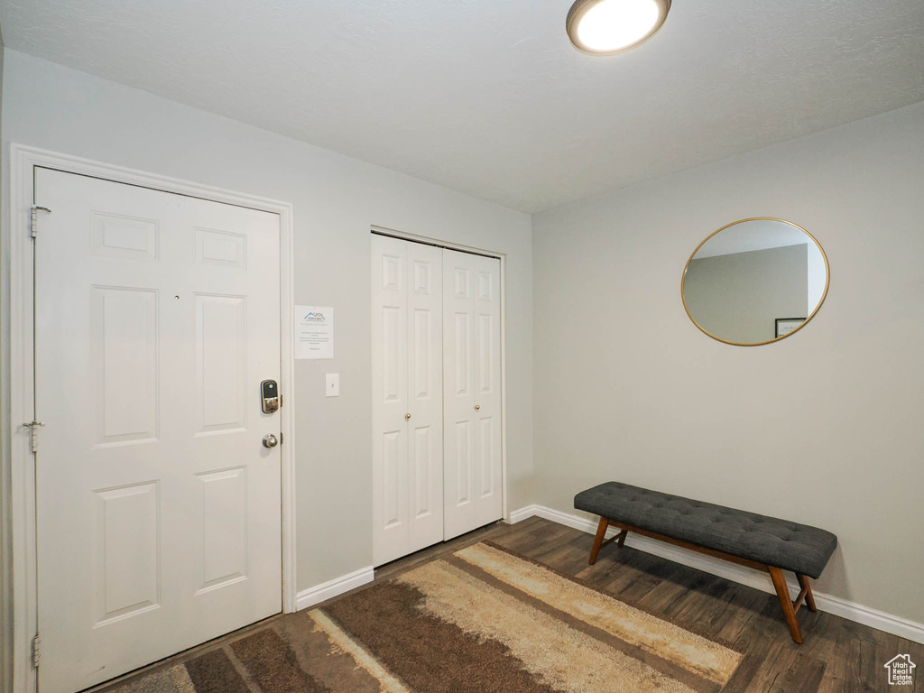 Entrance foyer with wood-type flooring