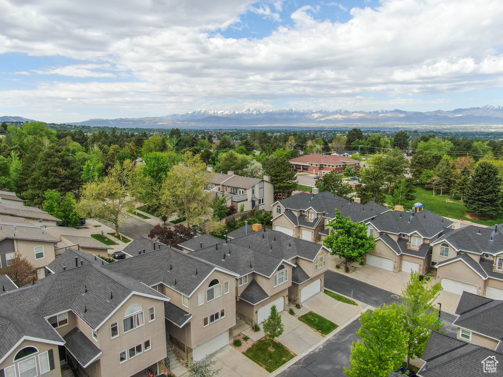 Birds eye view of property with a mountain view