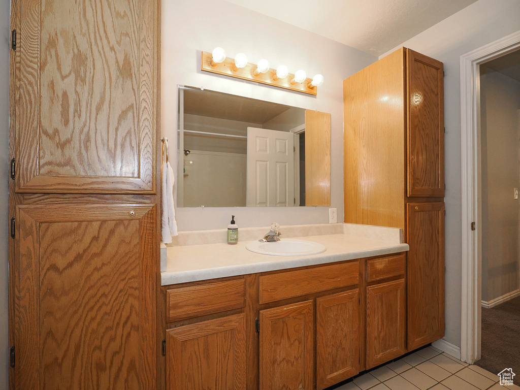 Bathroom with vanity and tile floors