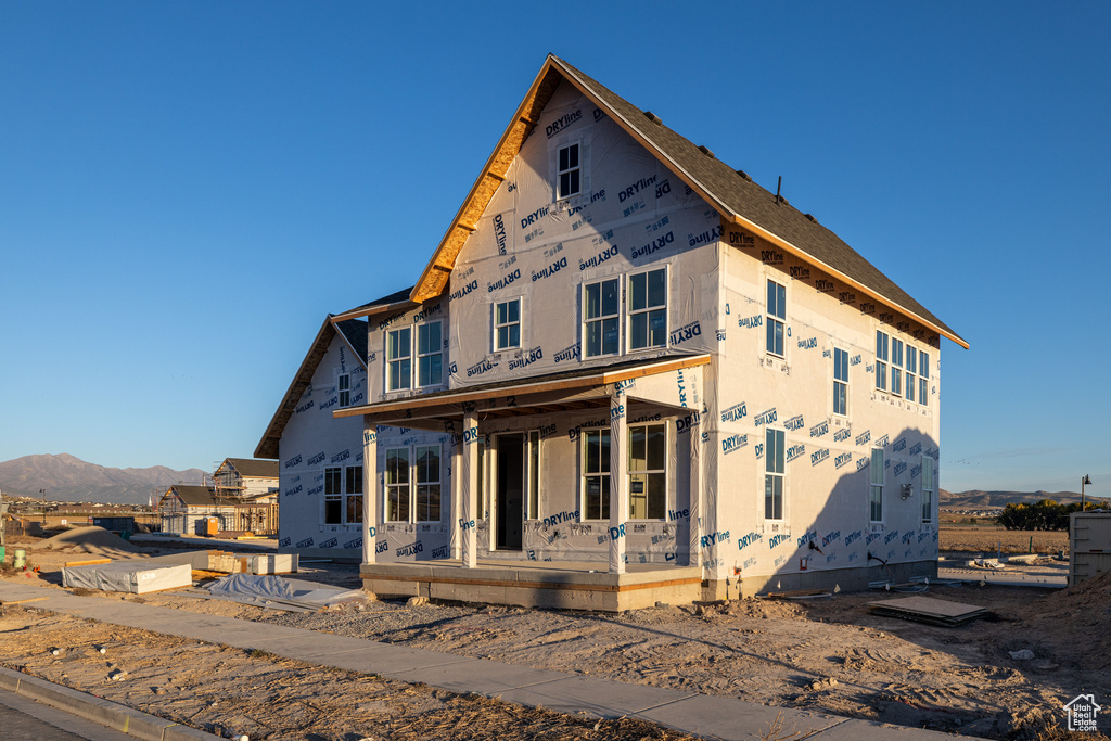 Property under construction with a mountain view