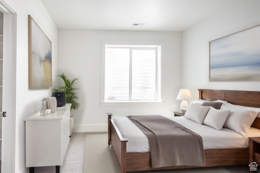 Bedroom featuring multiple windows