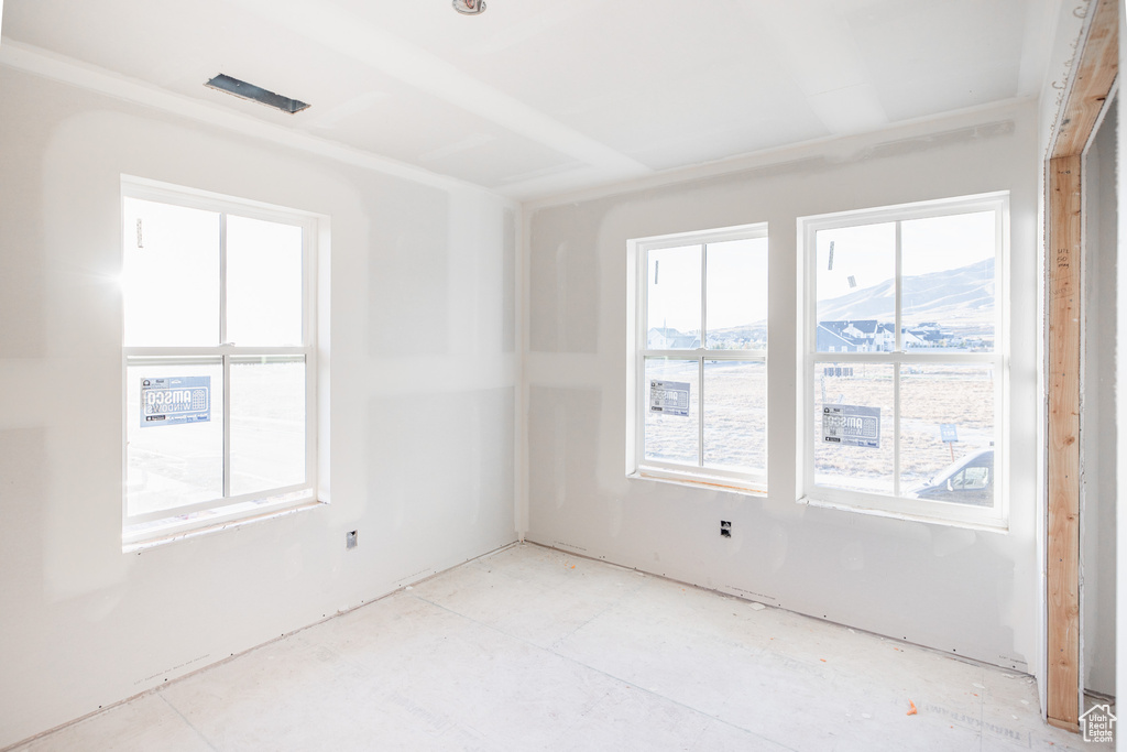 Spare room featuring a mountain view