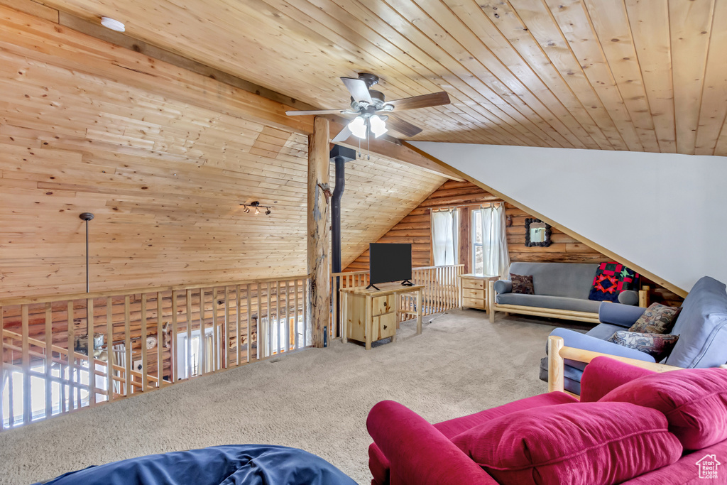 Living room featuring ceiling fan, vaulted ceiling, carpet floors, and wooden ceiling