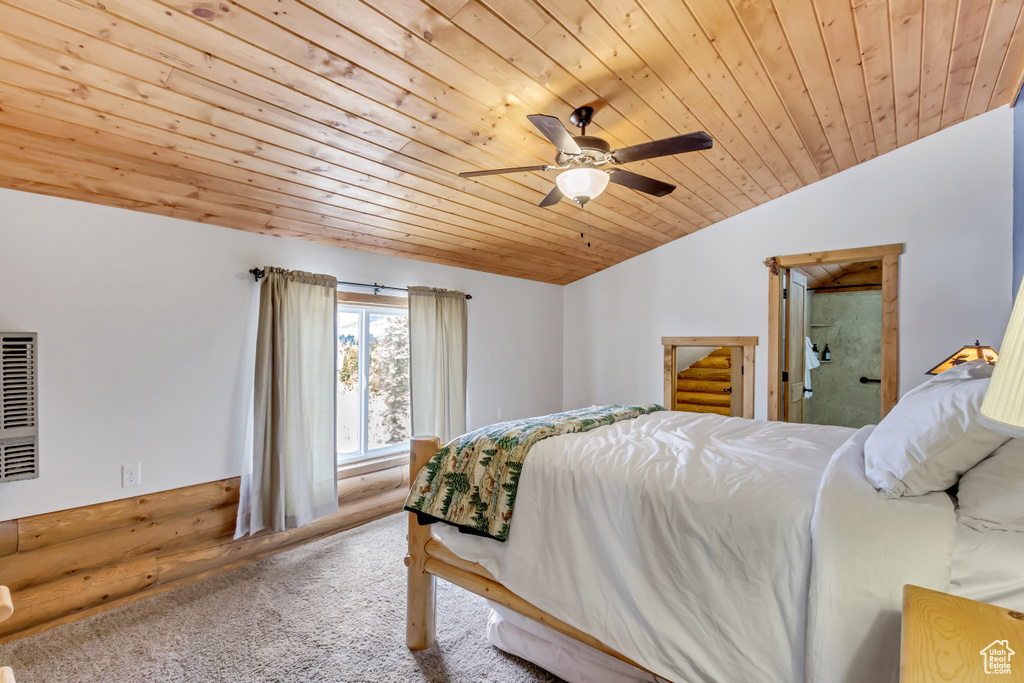 Carpeted bedroom featuring lofted ceiling, ceiling fan, and wood ceiling