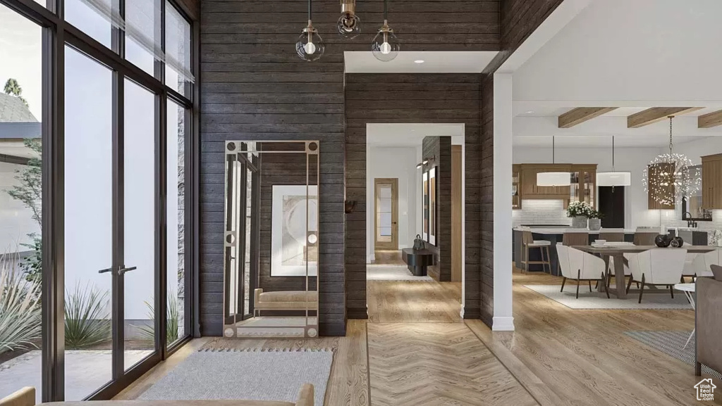 Entryway featuring a towering ceiling and hardwood / wood-style floors