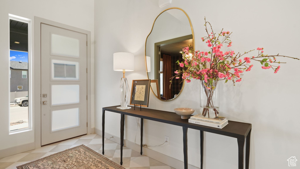 Entryway with light tile flooring