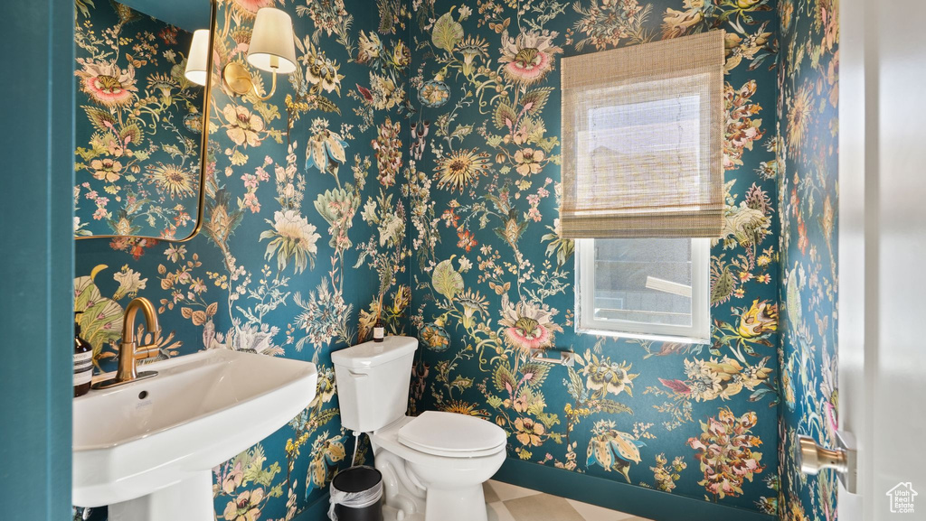 Bathroom with sink and toilet