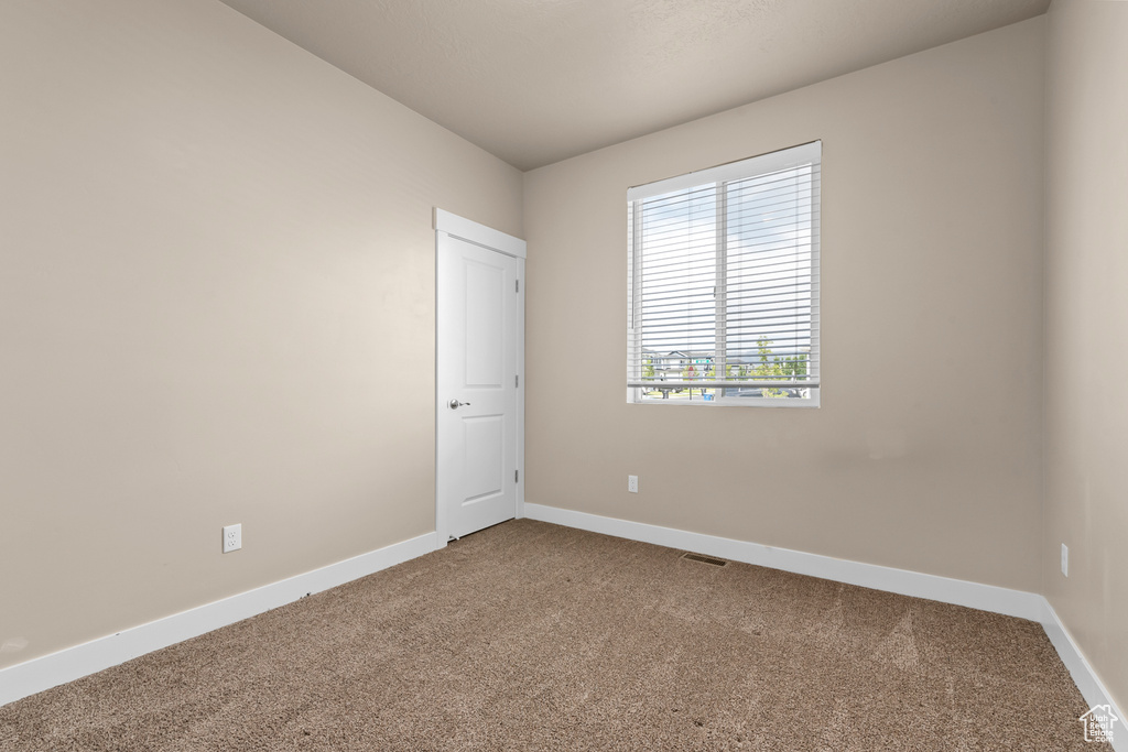 Spare room with carpet floors