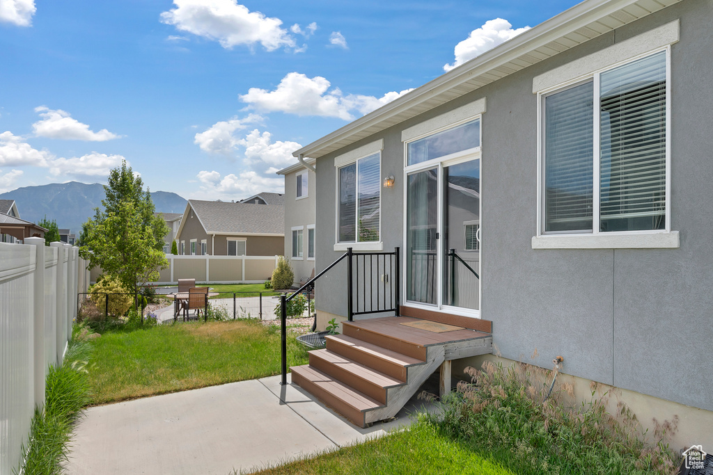 Exterior space with a patio and a mountain view