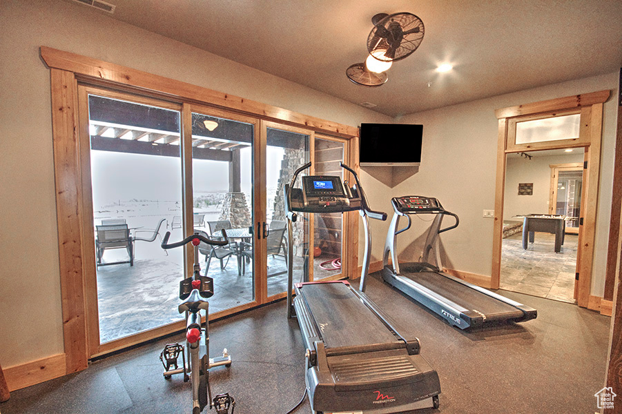 Exercise area featuring tile floors