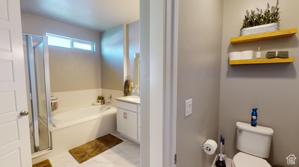 Full bathroom featuring independent shower and bath, vanity, toilet, and tile floors