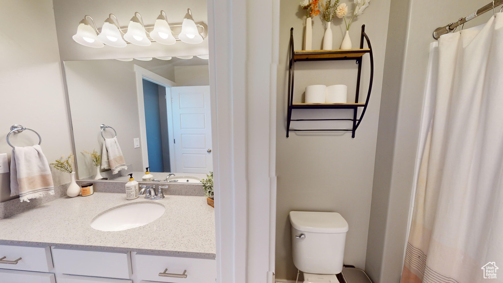 Bathroom with vanity and toilet