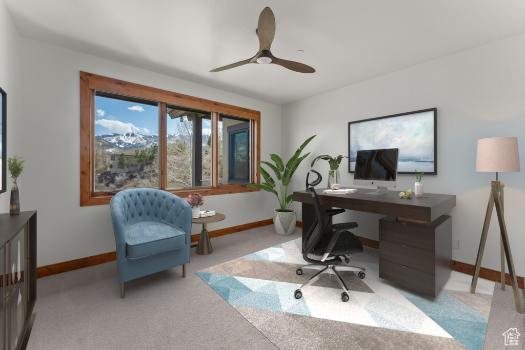 Carpeted office space featuring ceiling fan