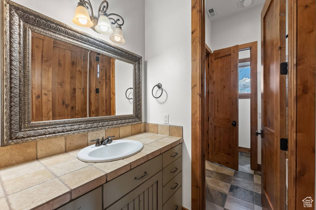 Bathroom with tile flooring and vanity