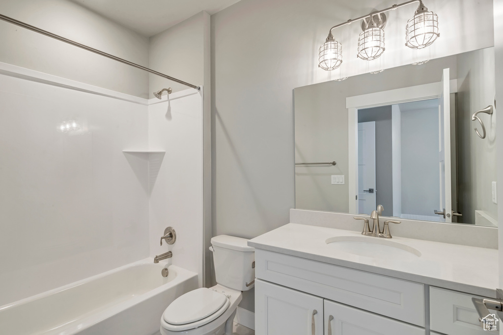 Full bathroom with vanity, toilet, and shower / washtub combination