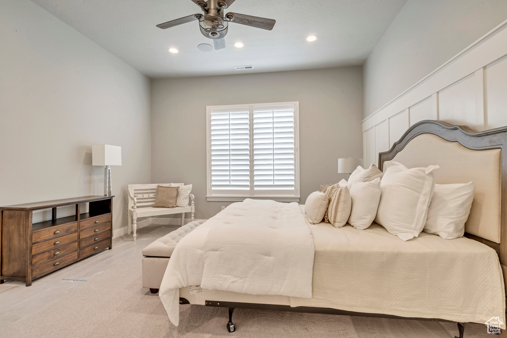 Bedroom featuring light colored carpet and ceiling fan