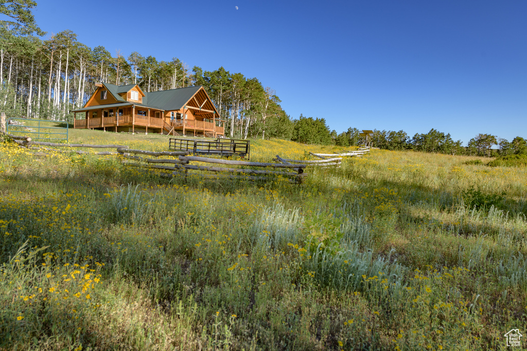 View of yard featuring a rural view and an outdoor structure