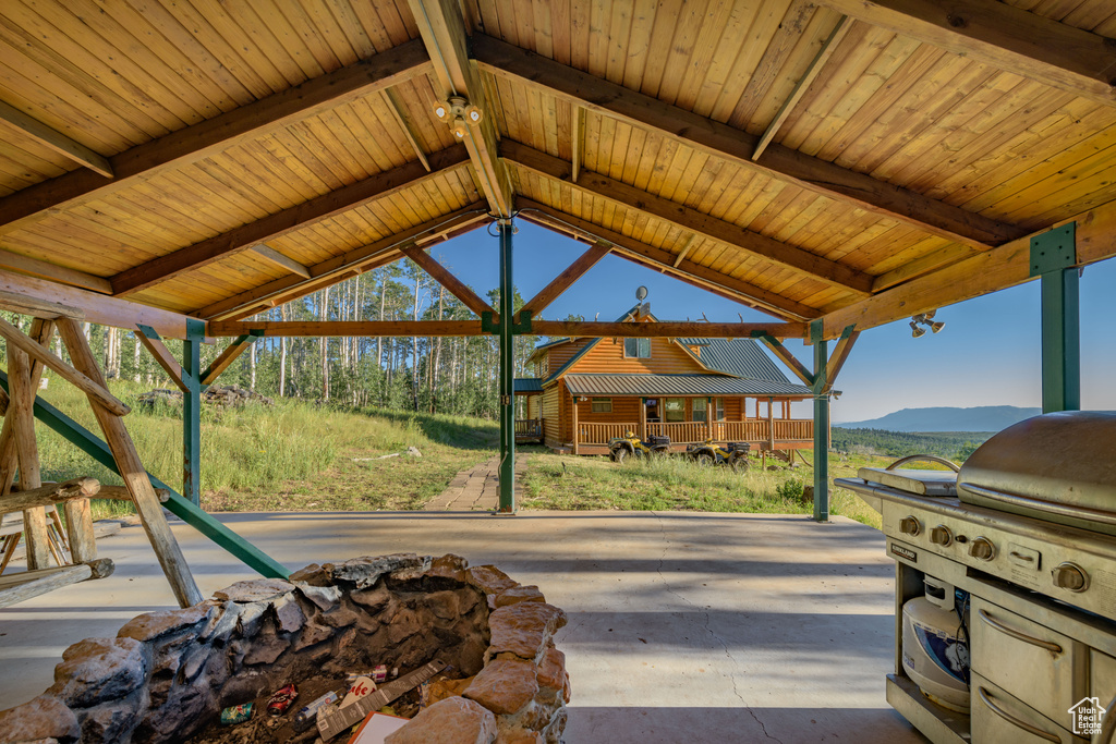 View of patio with a mountain view, a gazebo, and area for grilling