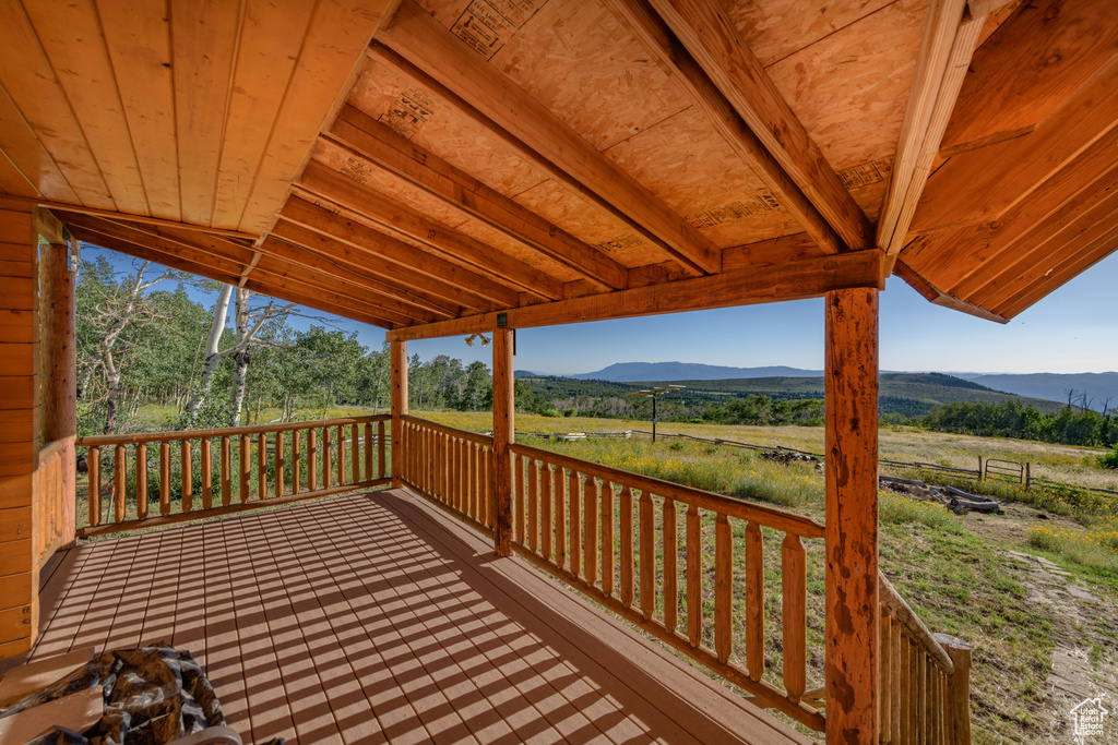 Wooden deck featuring a mountain view