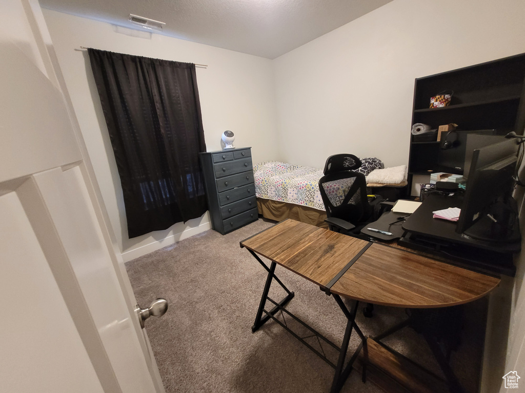 Office area featuring carpet flooring