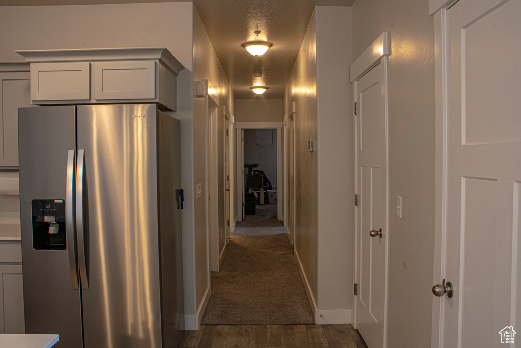 Corridor with dark colored carpet