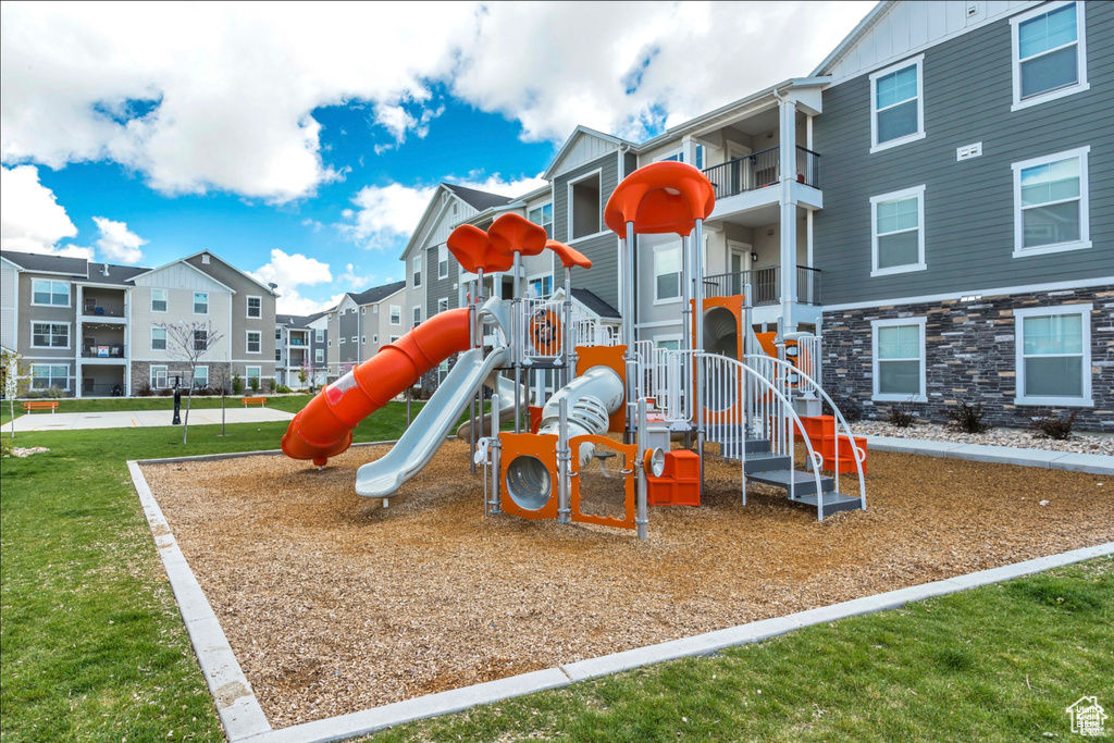 View of play area with a lawn