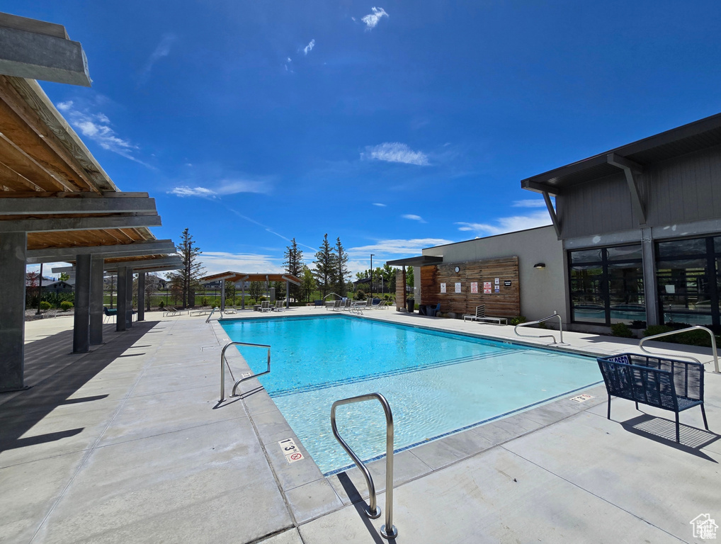 View of swimming pool featuring a patio