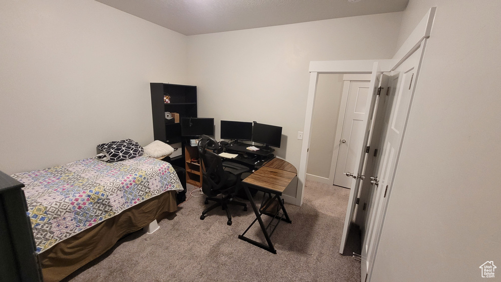 View of carpeted bedroom