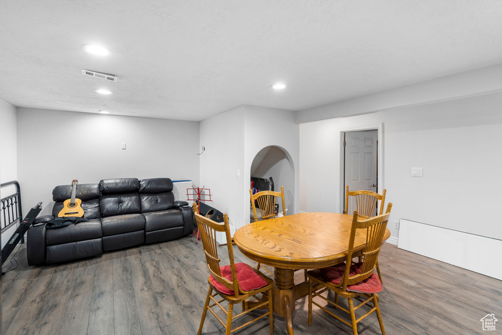 Dining area with hardwood / wood-style flooring