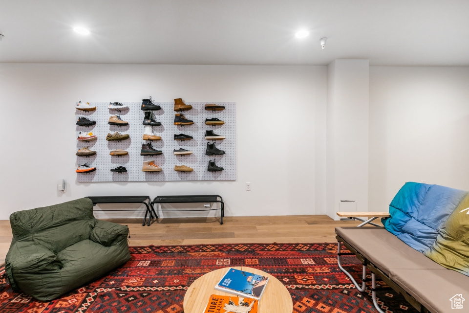 Sitting room with hardwood / wood-style flooring