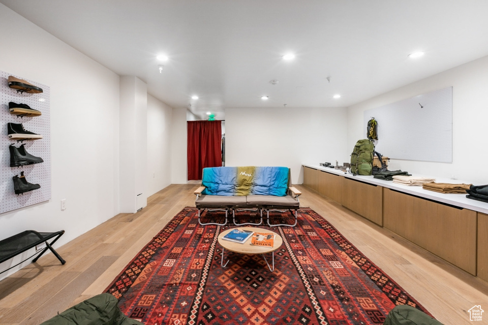 Living room with light hardwood / wood-style flooring