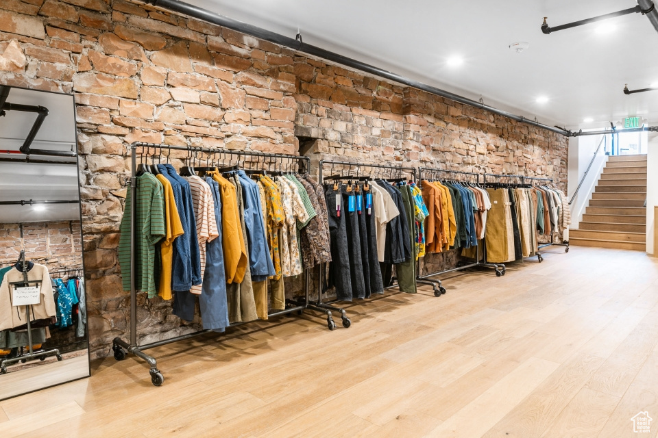 Spacious closet with light hardwood / wood-style flooring