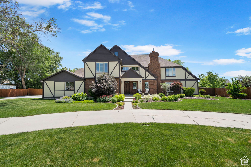 English style home featuring a front yard