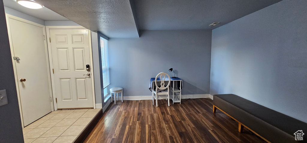 Interior space featuring a textured ceiling